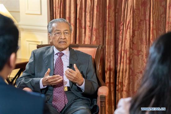 Malaysian Prime Minister Mahathir Mohamad speaks during an interview with Chinese media at the Prime Minister's Office in Putrajaya, Malaysia, April 8, 2019. (Xinhua/Zhu Wei)
