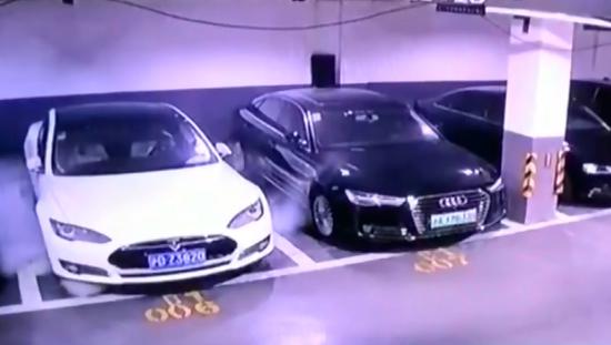 A video footage shows a Tesla vehicle parked in an underground garage in Shanghai, April 21, 2019. (Photo/Screenshot)