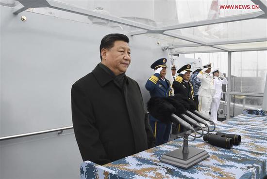 Chinese President Xi Jinping, also general secretary of the Communist Party of China Central Committee and chairman of the Central Military Commission, reviews a multinational fleet during a naval parade held in Qingdao, east China's Shandong Province, on April 23, 2019. A naval parade was staged here to mark the 70th founding anniversary of the Chinese People's Liberation Army Navy on Tuesday. (Xinhua/Li Gang)