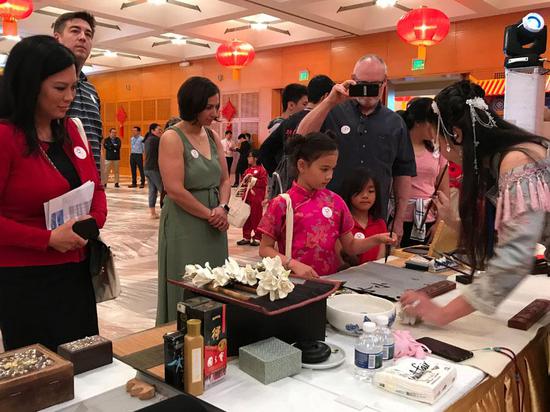 People attends a promotion of the China Tourism and Culture Week in New York, the U.S. , May 4, 2019. (Photo provided to China Daily)