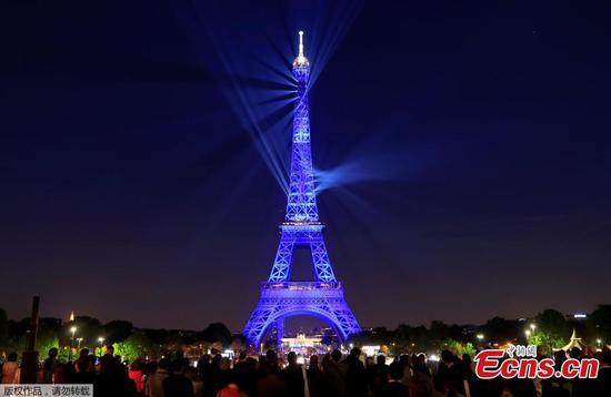 Eiffel Tower in laser and strobe light show for 130th birthday