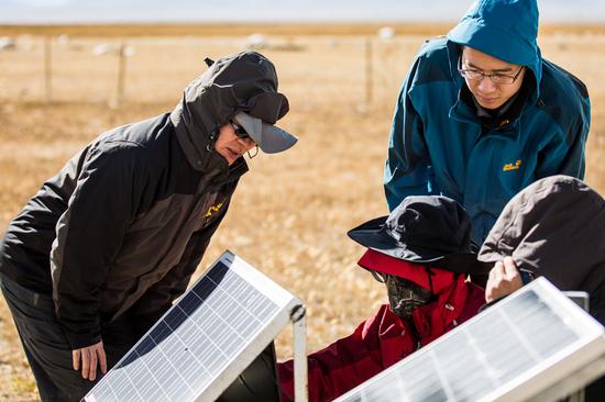 Dr. Yang Kun (left) and his team study the transfer of water and energy on China's Tibet Plateau. (Photo by Wang Tiezheng)