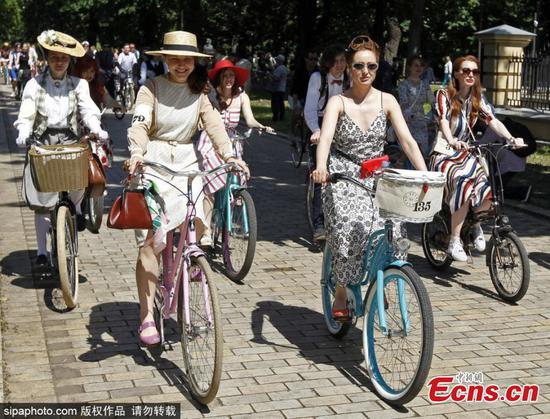 People in vintage clothes attend cycling event in Ukraine