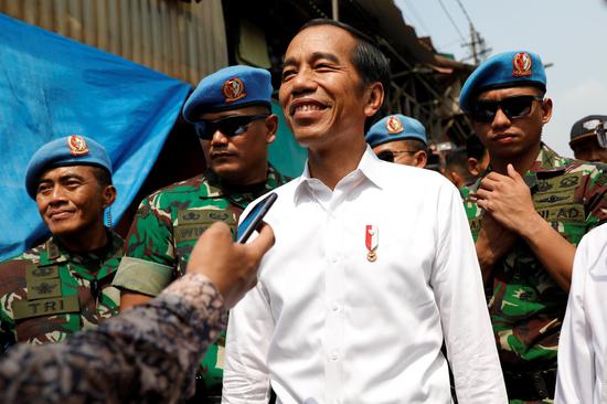 Indonesia's Incumbent President Joko Widodo reacts after making a public address with his running mate Ma'ruf Amin, following the announcement of the last month's presidential election results at a rural area of Jakarta, Indonesia, May 21, 2019. (Photo/Agencies)