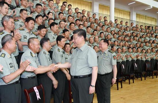 Chinese President Xi Jinping, also general secretary of the Communist Party of China Central Committee and chairman of the Central Military Commission, meets with military officers and experts at the Army Infantry College of the People's Liberation Army in east China's Jiangxi Province. Xi inspected the Army Infantry College of the People's Liberation Army in east China's Jiangxi Province Tuesday. (Xinhua/Li Gang)