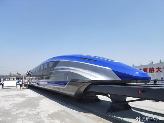 A prototype magnetic-levitation train with a top speed of 600 km per hour is rolled off production line in  Qingdao, Shandong Province, May 23, 2019. (Photo/Xinhua)