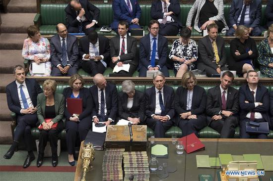 British Prime Minister Theresa May (C, front) and the leader of the House of Commons Andrea Leadsom (2nd L, front) attend the Prime Minister's Questions at the House of Commons in London, Britain, on May 22, 2019. The British leader of the House of Commons Andrea Leadsom on Wednesday resigned amid growing discontent with the prime minster's leadership, one day after the new Brexit agreement backfired. (Xinhua/UK Parliament/Mark Duffy)