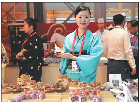 A participant shows Japanese style ice cream at the festival. (Photo by Li Yingxue/China Daily）