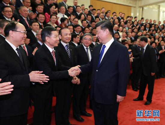 President Xi Jinping meets with overseas Chinese representatives who are in Beijing to attend the ninth Conference for Friendship of Overseas Chinese Associations and a plenary session of the board of directors of the China Overseas Friendship Association. (Photo/Xinhua