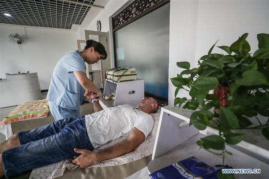 Hospital featuring TCM therapy attracts many Russian patients in NE China