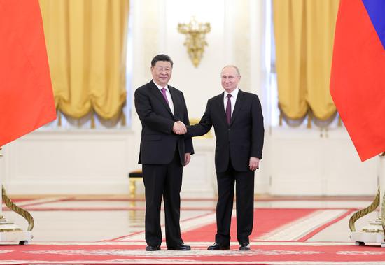 President Xi Jinping and Russian President Vladimir Putin meet in Kremlin after Xi's arrival in Moscow on Wednesday. Xi is paying a three-day state visit to the country.(Photo/Xinhua)