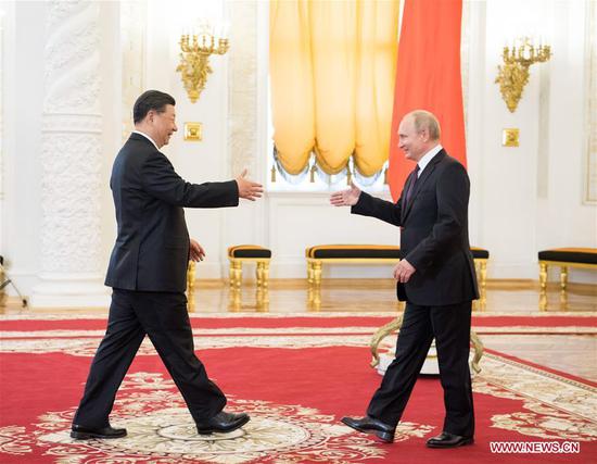 Chinese President Xi Jinping (L) shakes hands with his Russian counterpart Vladimir Putin ahead of their talks in Moscow, Russia, June 5, 2019. Xi Jinping held talks with Vladimir Putin at the Kremlin in Moscow on Wednesday. (Xinhua/Li Xueren)