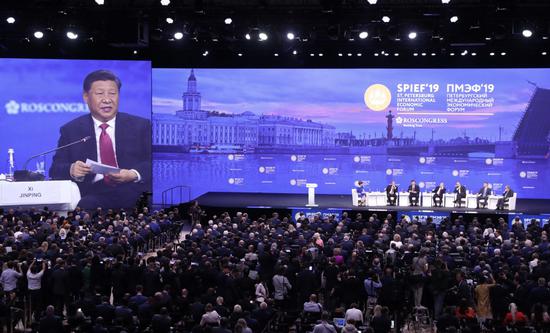 President Xi Jinping takes questions at the 23rd St. Petersburg International Economic Forum on Friday. [Photo by Kuang Linhua/China Daily]