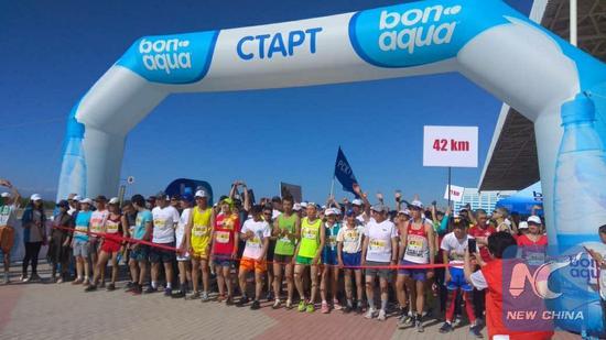 Participants wait at the starting line of the International Issyk-Kul Marathon of the Shanghai Cooperation Organization (SCO) 