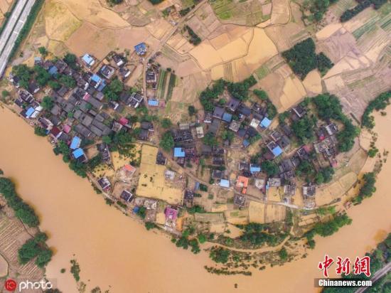 Photo taken by a drone shows a village is flooded  in China's Guangxi Zhuang Autonomous Region. (Photo/IC)