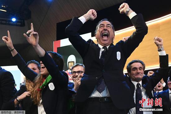 Members of the Italian delegation of 2026 Winter Olympics candidate city enjoy their moment of victory at Swiss Tech Convention Center, June 24, 2019. (Photo/Agencies)