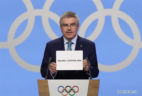 President of the International Olympic Committee (IOC) Thomas Bach announces Milan-Cortina d'Ampezzo of Italy to host the 2026 Olympic Winter Games during the 134th session of International Olympic Committee (IOC) in Lausanne, Switzerland, June 24, 2019. (Xinhua/Cao Can)