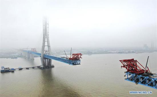 Main tower of world's largest road-rail cable-stayed bridge built