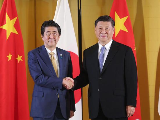 Chinese President Xi Jinping (R) meets with Japanese Prime Minister Shinzo Abe in Osaka, Japan, June 27, 2019. (Xinhua/Ju Peng)