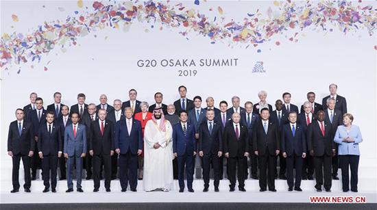 Chinese President Xi Jinping(4th R, front) poses for a group photo with the other leaders attending the 14th G20 summit held in Osaka, Japan, June 28, 2019. Xi called on G20 to join hands in forging high-quality global economy while addressing the 14th G20 summit held in the Japanese city of Osaka. (Xinhua/Huang Jingwen)