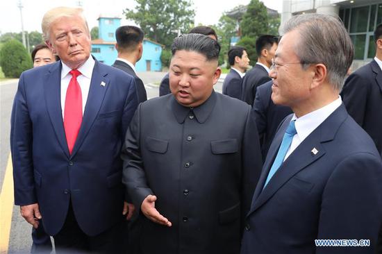 Kim Jong Un (C), top leader of the Democratic People's Republic of Korea (DPRK), U.S. President Donald Trump (L) and South Korean President Moon Jae-in meet at the truce village of Panmunjom on June 30, 2019. (Xinhua/NEWSIS)