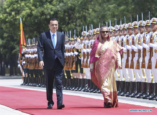 Chinese Premier Li Keqiang holds a welcome ceremony for Bangladeshi Prime Minister Sheikh Hasina, who is paying an official visit to China, ahead of their talks at the Great Hall of the People in Beijing, capital of China, July 4, 2019. (Xinhua/Zhang Ling)