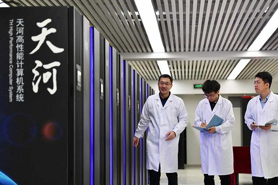 Scientists check the condition of the Tianhe-3 supercomputer at the National Supercomputer Center in Tianjin. (Photo/Xinhua)