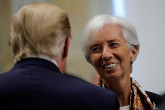 International Monetary Fund Managing Director Christine Lagarde chats with U.S. President Donald Trump during a dinner in honor of Qatar's Emir Sheikh Tamim bin Hamad Al-Thani at the U. S. Department of the Treasury in Washington D.C., U.S., July 8, 2019. （Photo/Agencies）