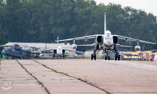 A JH-7A fighter bomber attached to the Chinese PLA Air Force taxies on runway after landing at the airport on July 20. All aircraft of the PLA Air Force to participate in the 