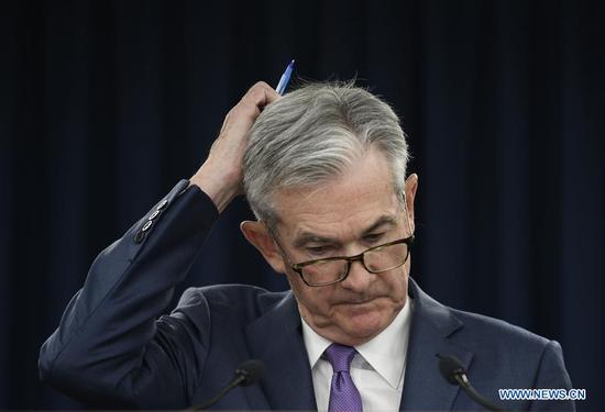U.S. Federal Reserve Chairman Jerome Powell reacts during a press conference in Washington D.C., the United States, on July 31, 2019. (Xinhua/Liu Jie)