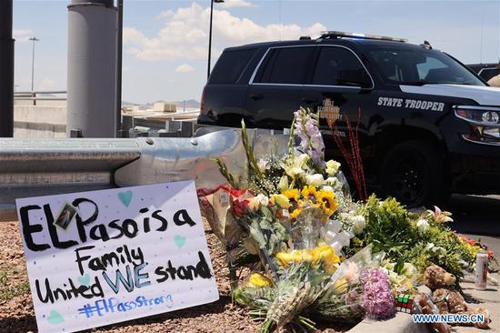 A temporary memorial site for mass shooting victims is seen near the Walmart shopping mall area in El Paso of Texas, the United States, on Aug. 4, 2019.   (Xinhua/Liu Liwei)