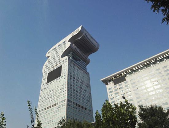 No 5 building of Pangu Plaza (left) in Beijing on Monday. LIU HONGSHENG/FOR CHINA DAILY