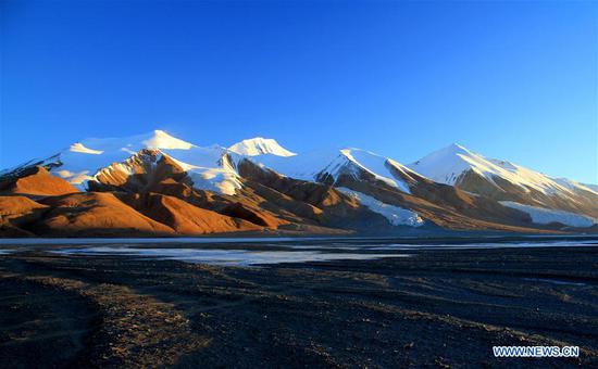 File photo shows snow mountains and rivers in Hoh Xil of northwest China's Qinghai Province. (Xinhua/Hoh Xil National Reserve Administration)