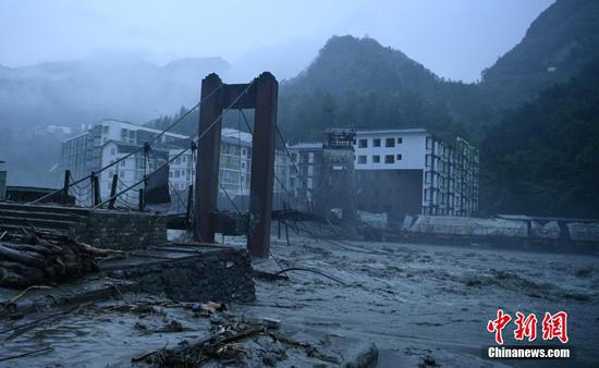 A suspending bridge is damaged by rain-triggered mudslides in Wenchuan, Sichuan Province, Aug. 20, 2019. (Photo/China News Service)