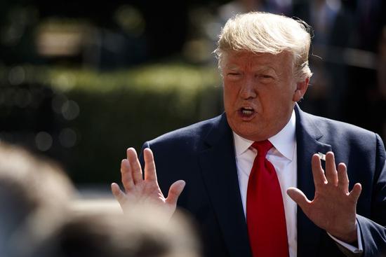 U.S. President Donald Trump speaks to reporters before leaving the White House in Washington D.C., the United States, on Aug. 9, 2019. (Photo by Ting Shen/Xinhua)