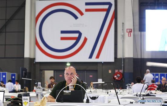 Journalists work at the G7 summit press center in Biarritz, France, Aug. 25, 2019. Leaders from the world's seven most industrialized countries started the divided group's 45th summit, clouded by a pile of tough issues with trade tensions high on agenda, on Saturday evening at the French seaside resort Biarritz. (Xinhua/Gao Jing)