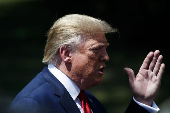 U.S. President Donald Trump speaks to reporters before leaving the White House in Washington D.C., the United States, on Aug. 21, 2019. (Photo by Ting Shen/Xinhua)