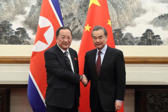 State Councilor and Foreign Minister Wang Yi (R) meets with DPRK Foreign Minister Ri Yong-ho in Beijing, Dec 7, 2018. [Photo by Wang Jing/China Daily]