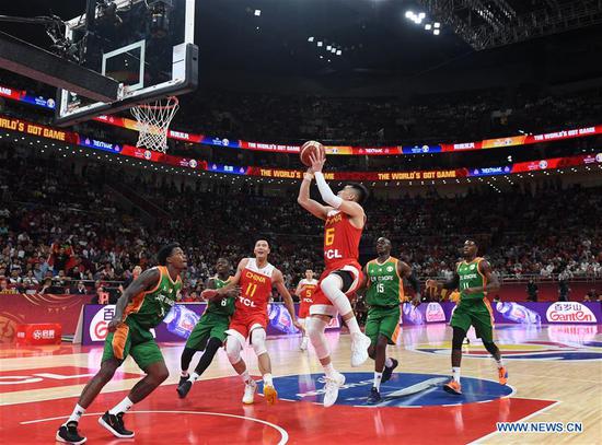 Guo Ailun (Top) of China competes during the group A match between China and Cote d'Ivoire at the FIBA World Cup 2019 in Beijing, Aug. 31, 2019. (Xinhua/Zhang Chenlin)