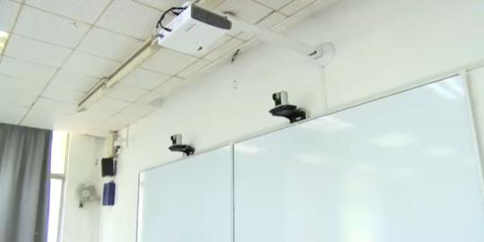 Electronic monitors are installed in a classroom in China Pharmaceutical University. (Photo/www.thepaper.cn)