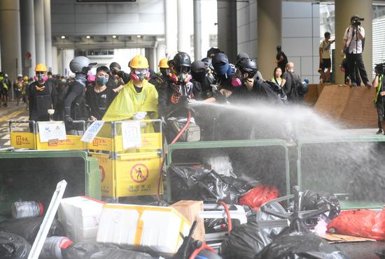 Radical protesters build barricades at Hong Kong International Airport in south China's Hong Kong, Sept. 1, 2019. (Xinhua)