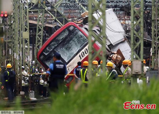 Rescue team works at the crash site, where a train is derailed after a collision with a truck at a crossing in Yokohama, Kanagawa Prefecture on Sept. 5, 2019. (Photo/Agencies)