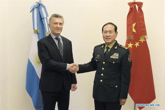 Argentine President Mauricio Macri (L) shakes hands with visiting Chinese State Councilor and Minister of National Defense Wei Fenghe in Buenos Aires, Argentina, Sept. 4, 2019. (Xinhua/Fan Xianhai)