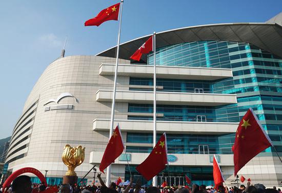 People attend a national flag raising ceremony at the Golden Bauhinia Square in Hong Kong, south China, Sept. 8, 2019. (Xinhua/Li Gang)