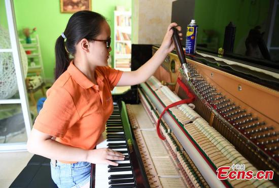 Blind woman turns piano tuner 
