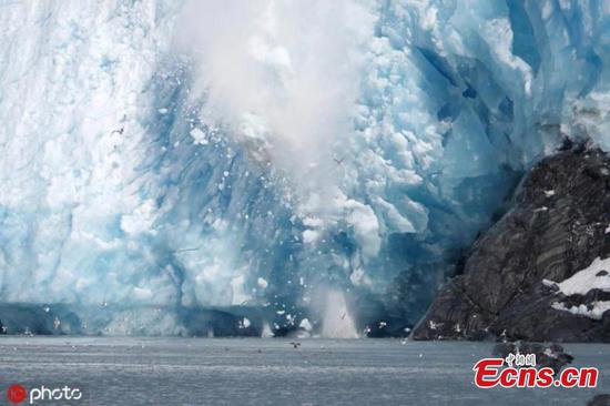 Incredible moment slabs of ice from Alaska glacier smash into sea 