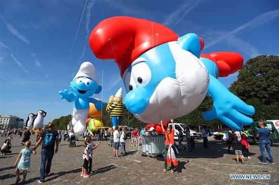 People attend Balloon's Day Parade of 2019 Brussels Comic Strip Festival