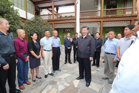 Chinese President Xi Jinping, also general secretary of the Communist Party of China Central Committee and chairman of the Central Military Commission, meets local representatives of the Red Army veterans' descendants as well as relatives of the revolutionary martyrs in Xinxian County, central China's Henan Province, Sept. 16, 2019. Xi went on an inspection tour in Henan Monday. (Xinhua/Ju Peng)