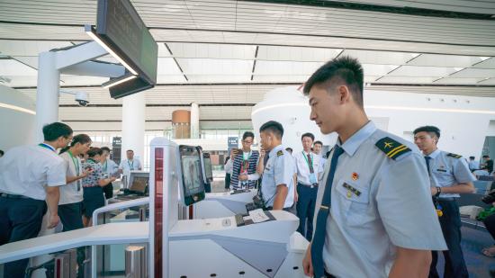 A China Eastern Airlines staff member tests facial scanning equippment at the Daxing International Airport. (Photo provided by China Eastern Airlines)