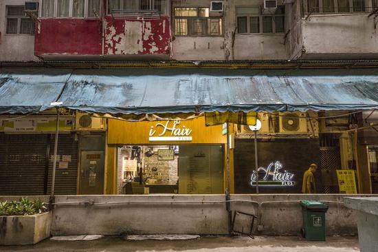 An old man walks home in Quarry Bay, south China's Hong Kong Special Administrative Region, Sept. 18, 2019. (Xinhua/Lu Ye)